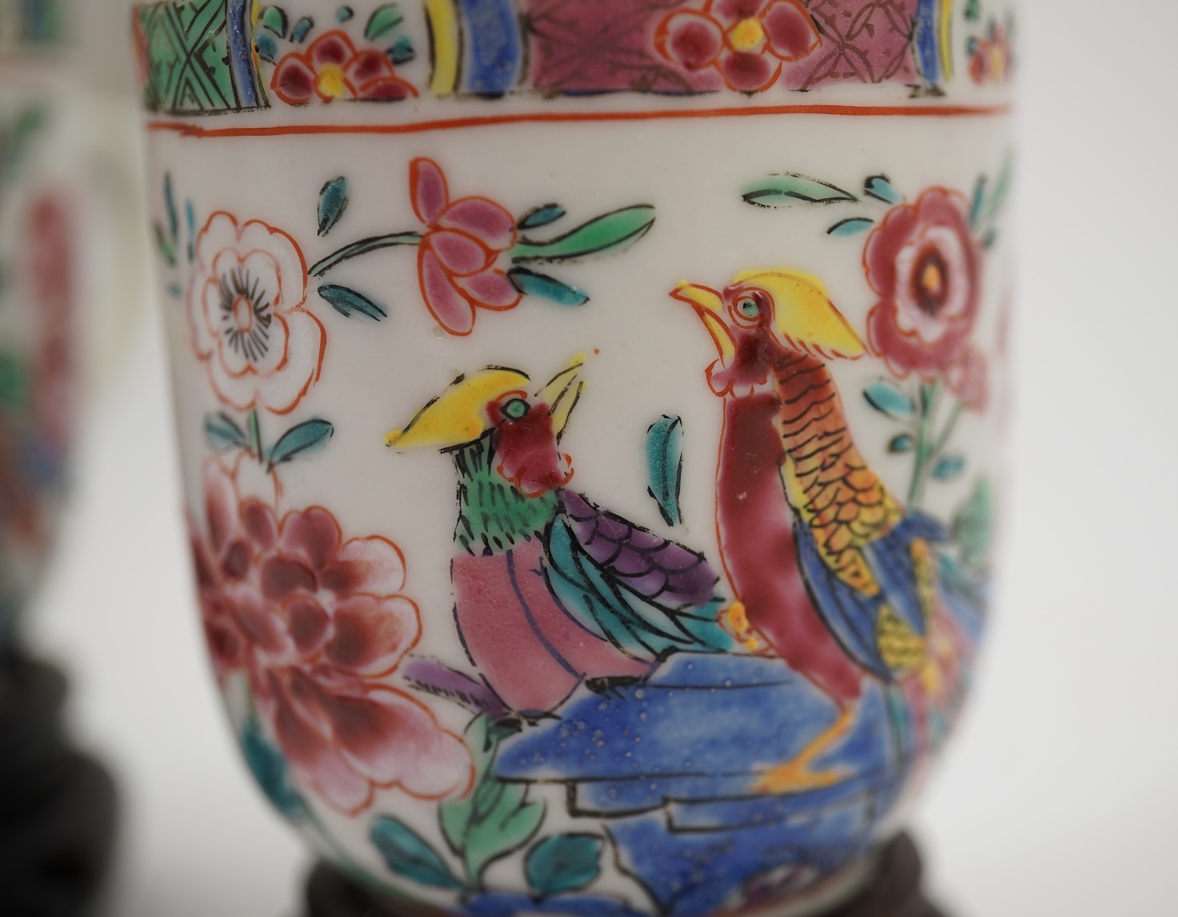 A near pair of Chinese famille rose ‘double pheasant’ coffee cups, early Qianlong period